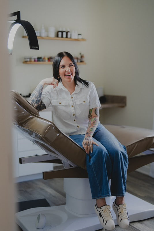 Paige teaching a microblading student